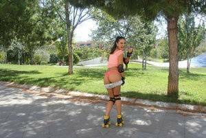 Latina solo girl Carolina Abril shedding shorts to expose nice ass outdoors on fanspics.net