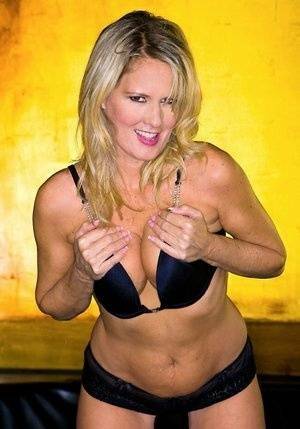 Blond MILF Bridgett Lee flaunting with her tits and big ass exposed on fanspics.net