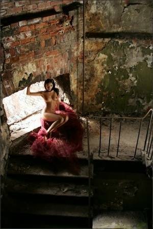 Slim brunette with a great ass models totally naked in deserted building on fanspics.net