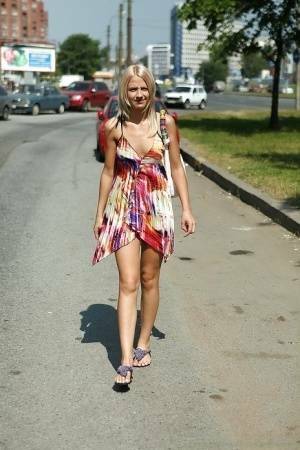 Charming teen blonde posing solo in a lovesome dress outdoor on fanspics.net