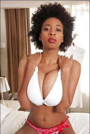 Ebony slut demonstrates her big tits in sexy glasses and red panties on fanspics.net