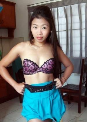 Cute Filipina girl strips naked in the confines of a sex tourist on fanspics.net