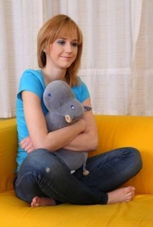 Strawberry blonde teen Lida kisses her guy after having sex on a sofa on fanspics.net