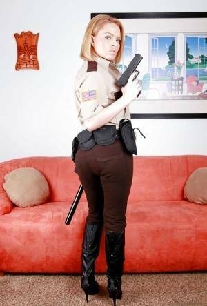 Hot babe in police uniform Krissy Lynn stripping and spreading her legs on fanspics.net