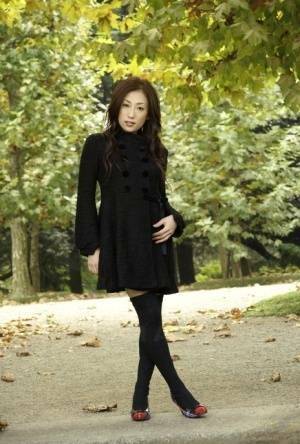 Fully clothed Japanese teen models in the park in black clothes and stockings - Japan on fanspics.net