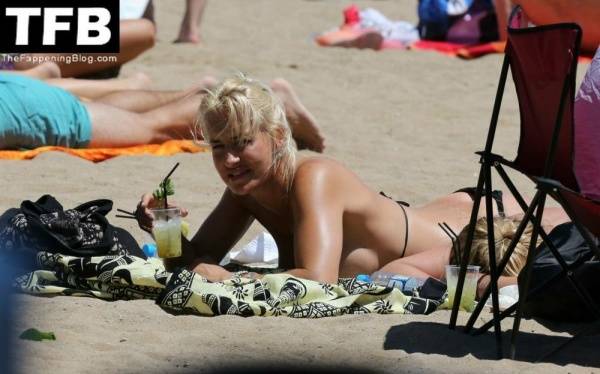 Sarah Connor Flashes Her Nude Breasts on the Beach on fanspics.net