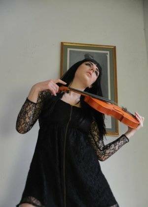 Dark haired violin player Sam Bentley strikes great poses while getting naked on fanspics.net