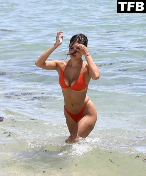 Tao Wickrath Stuns in Small Orange Bikini on the Beach in Miami on fanspics.net