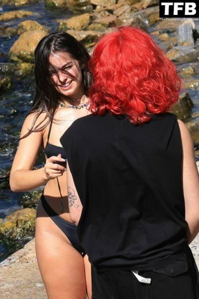 Addison Rae Displays Her Curves in a Black Bikini on Holiday with Omer Fedi on Lake Como on fanspics.net