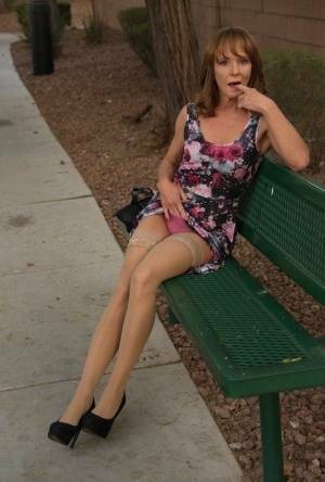 Aged lady flashes her tits and twat on a public bench before disrobing at home on fanspics.net