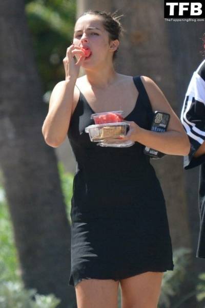 Addison Rae Indulges in Some Refreshing Watermelon While Out in a Tight Skirt with Her Boyfriend on fanspics.net