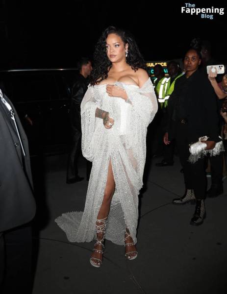 Rihanna Displays Her Curves in a White Dress (13 Photos) on fanspics.net